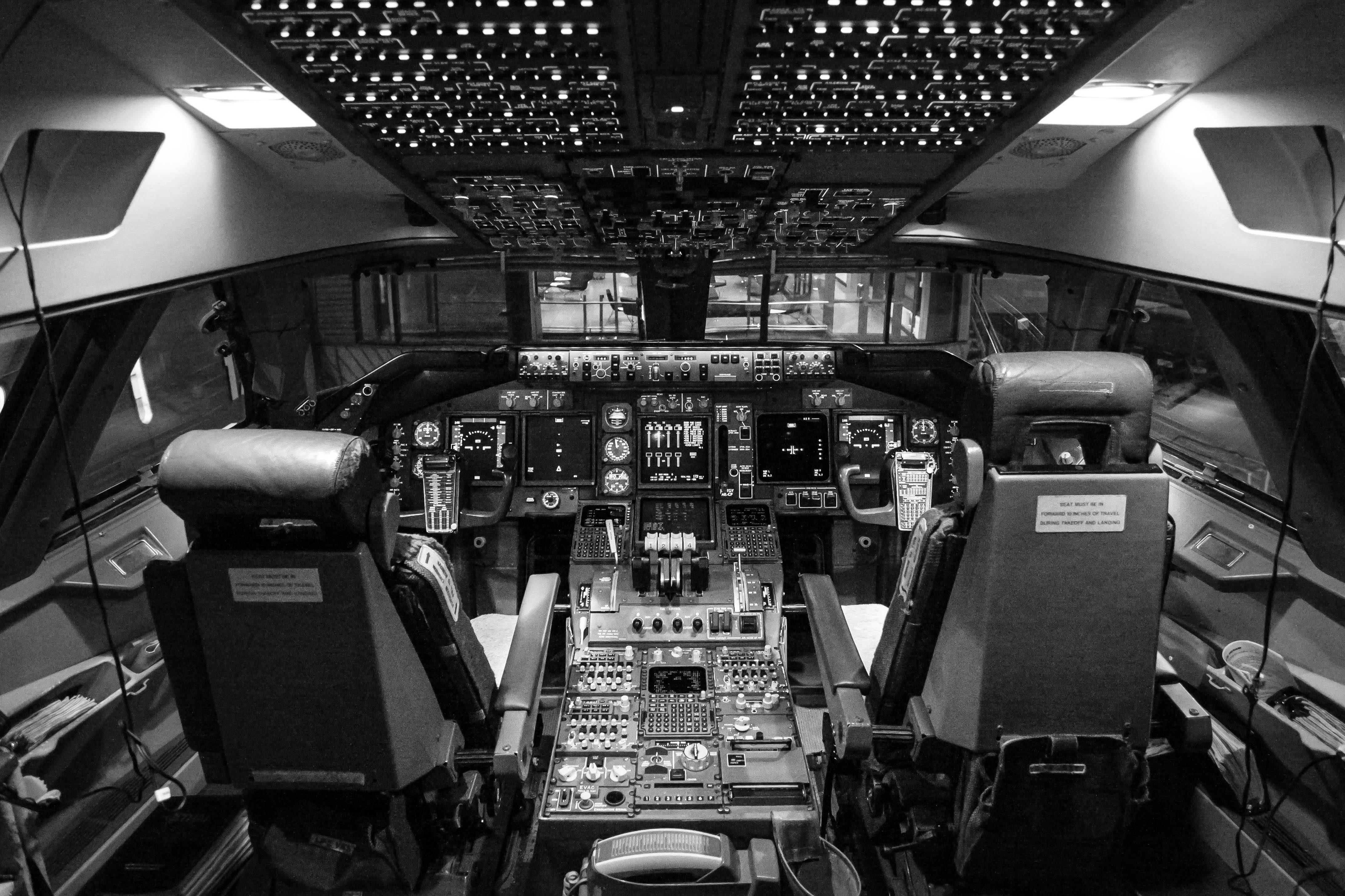 Inside of an aircraft cockpit with many buttons and switches